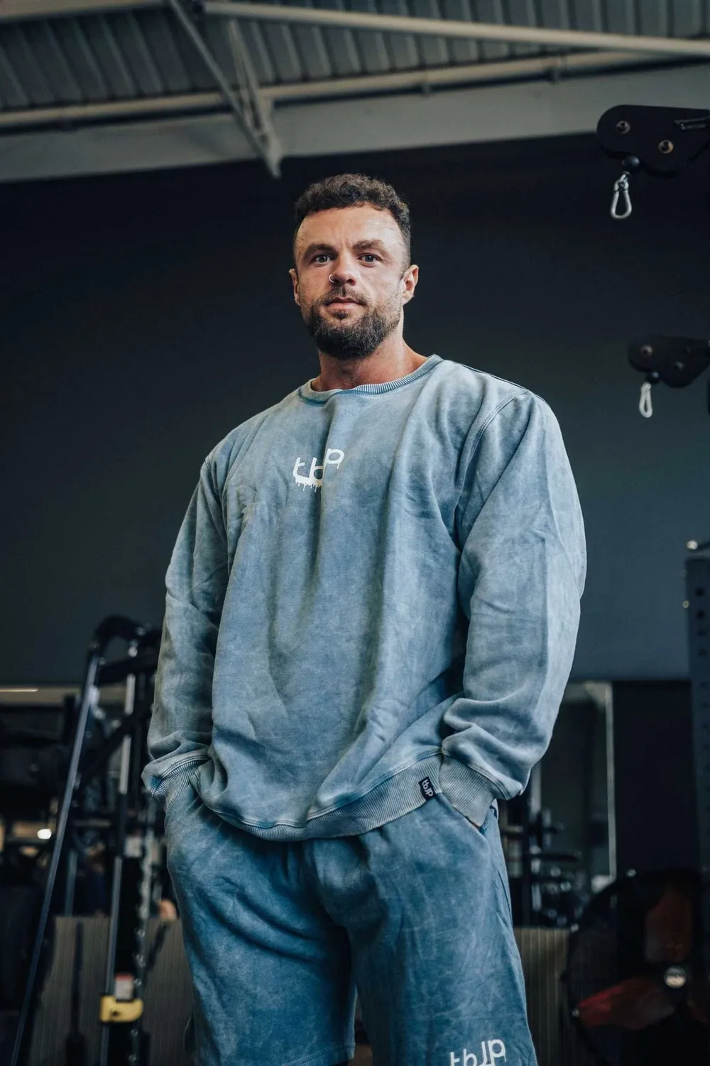 Trained by JP Drip Logo sweater blågrøn cream logo